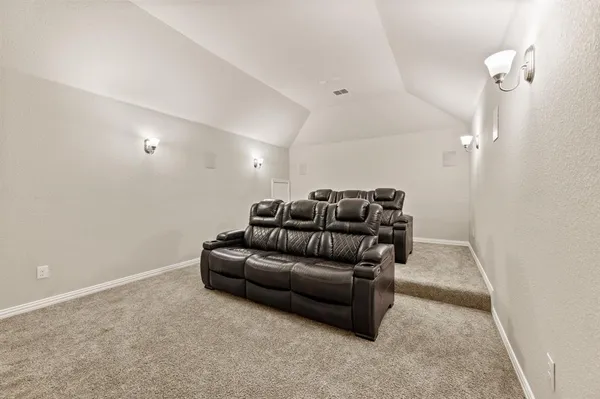 a living room with furniture and a rug