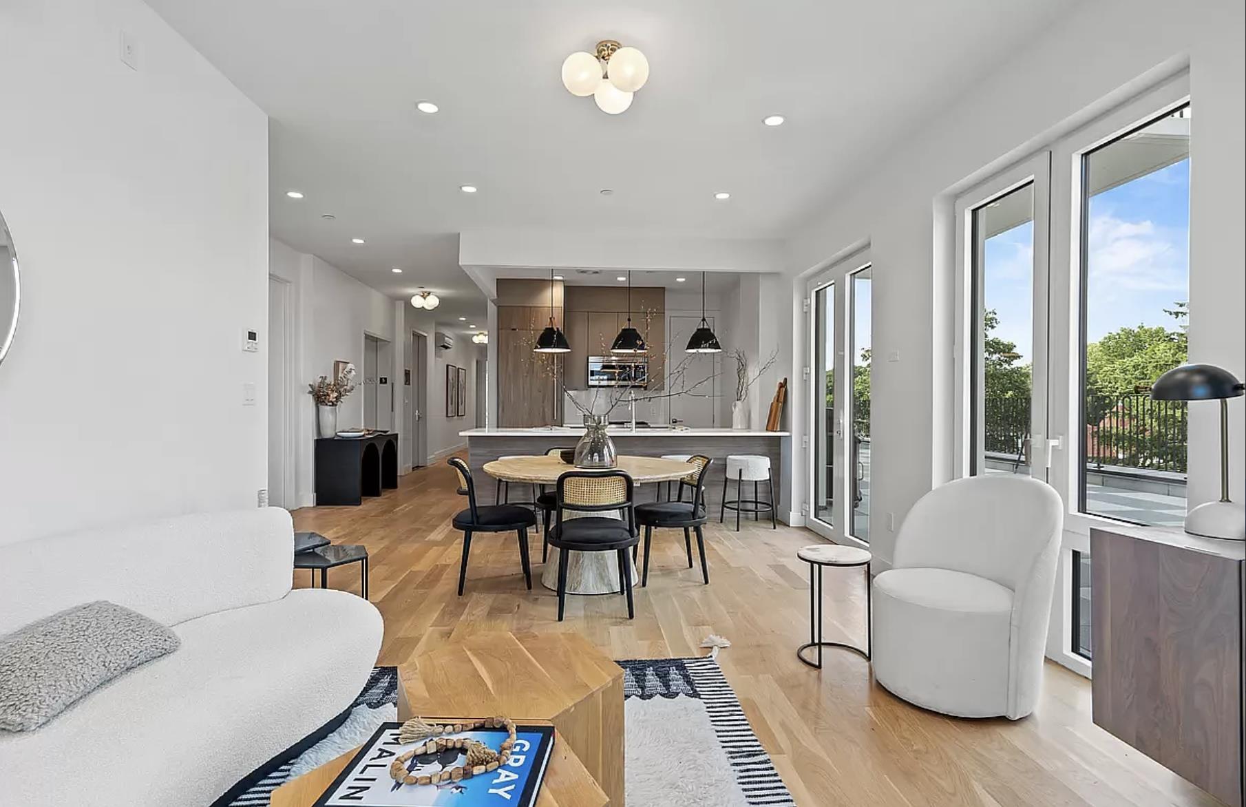 1105 Cortelyou Road, Unit PHA Brooklyn, NY 11218 - Photo 5 of 16 a living room with furniture a large window and dining table