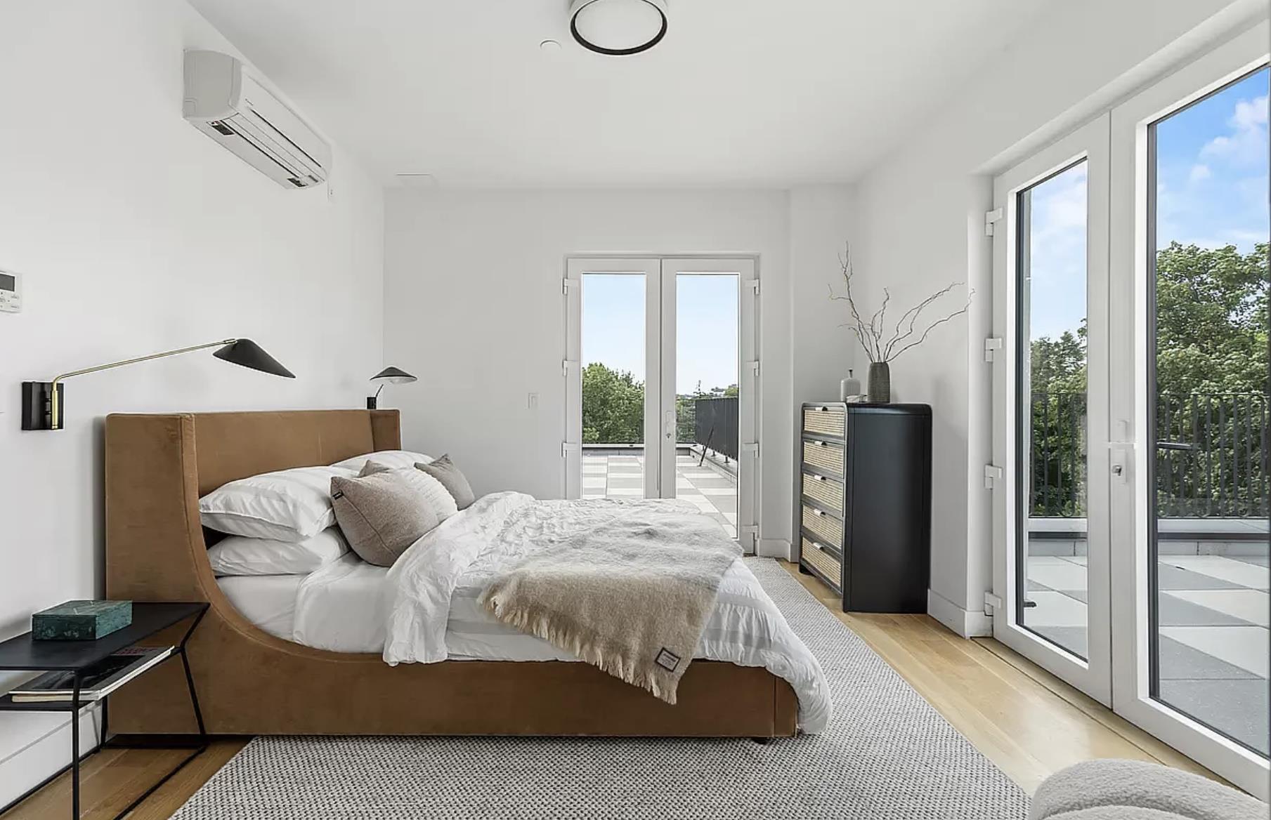 1105 Cortelyou Road, Unit PHA Brooklyn, NY 11218 - Photo 6 of 16 a bedroom with a bed and wooden floor