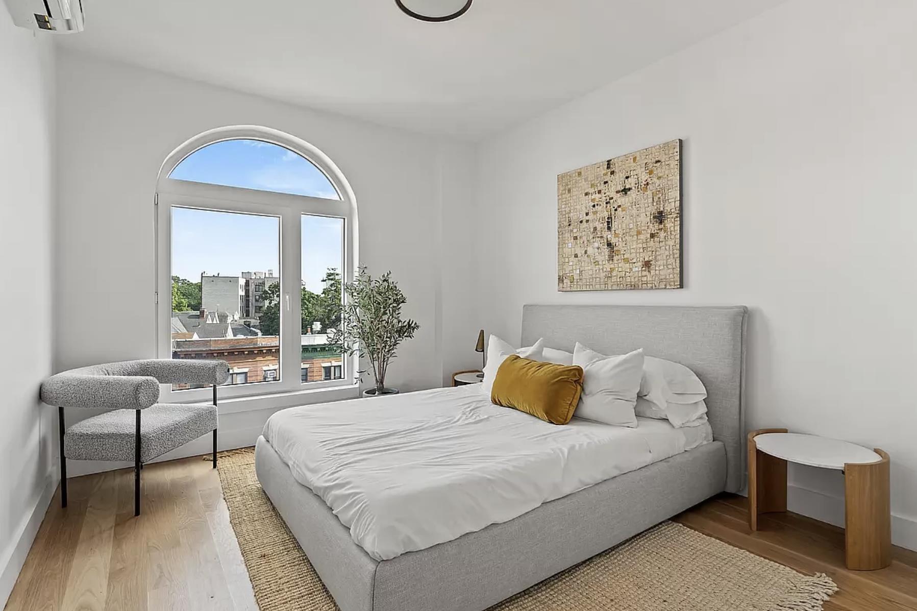 1105 Cortelyou Road, Unit PHA Brooklyn, NY 11218 - Photo 8 of 16 a bedroom with a large bed and a window