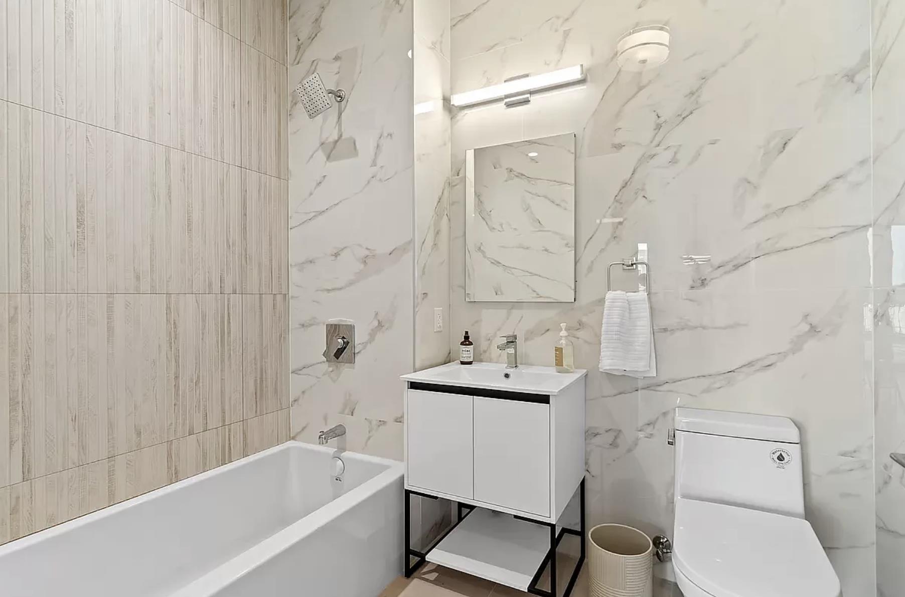 1105 Cortelyou Road, Unit PHA Brooklyn, NY 11218 - Photo 9 of 16 a bathroom with a sink toilet and shower