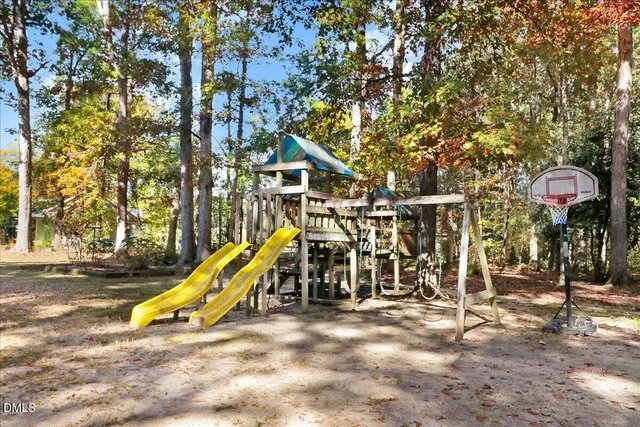 a view of a house with a snow in the background