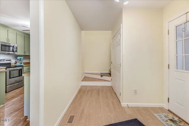 a bed room with a bed and a chandelier