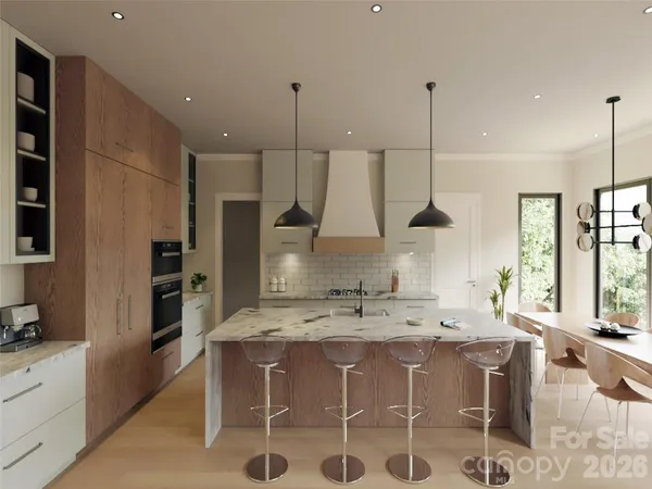 a kitchen with a sink a counter top space appliances and cabinets