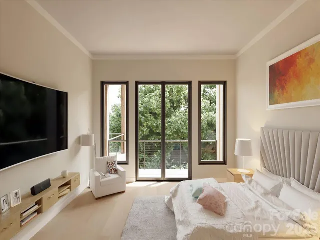 a bedroom with a bed and large window