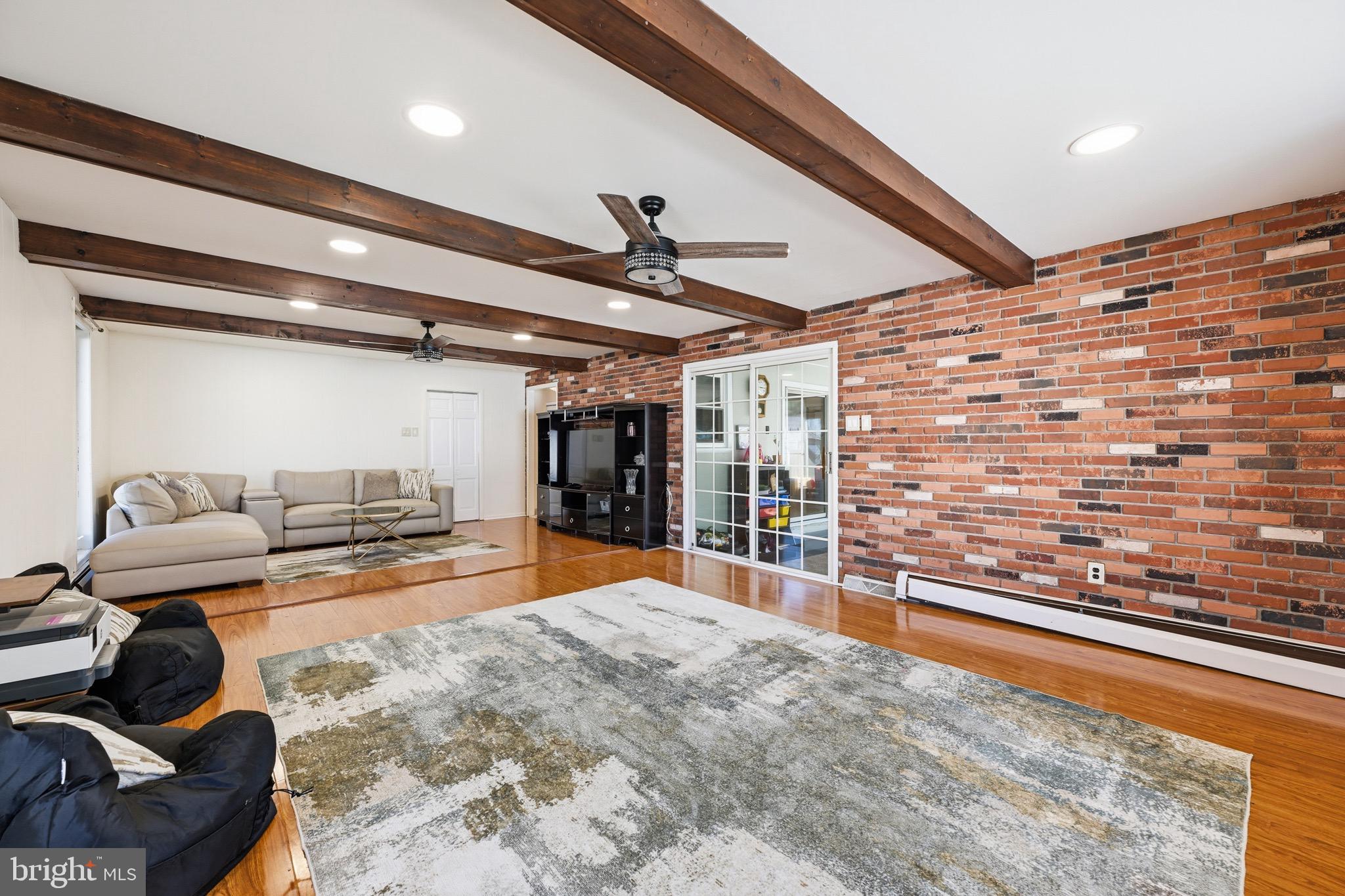 1087 Roberts Road Warminster, PA 18974 - Photo 13 of 36 Exposed brick brings warmth to the room.