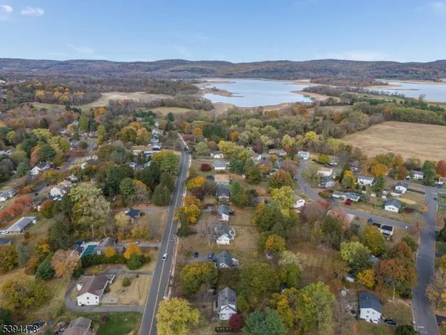 an aerial view of town and residential houses with outdoor space