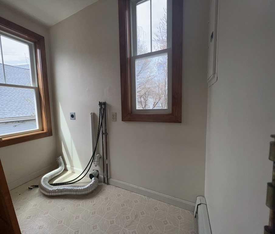 18 Houghton Street, Unit 1 Somerville, MA 02143 - Photo 12 of 13 a view of a room with gym equipment