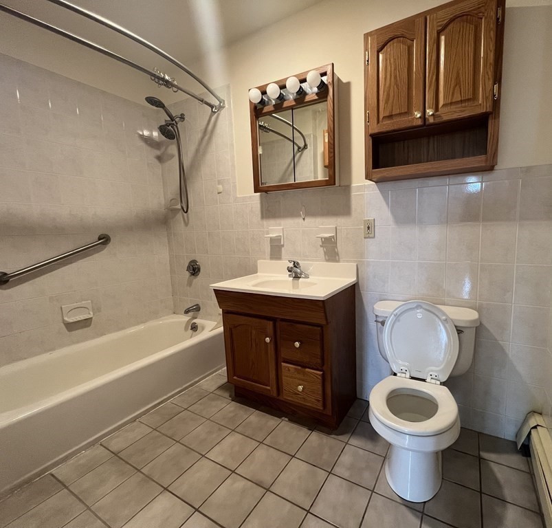 18 Houghton Street, Unit 1 Somerville, MA 02143 - Photo 13 of 13 a bathroom with a sink a toilet and bathtub
