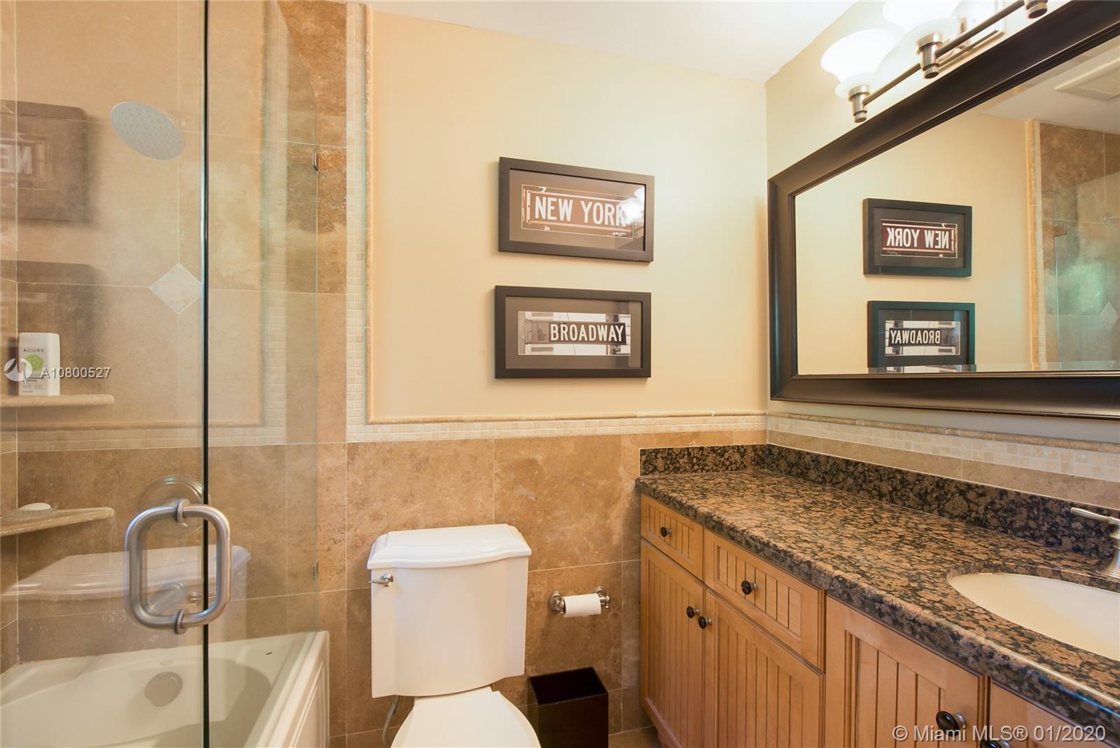 12440 Moss Ranch Road Pinecrest, FL 33156 - Photo 15 of 33 a bathroom with a granite countertop sink and a mirror