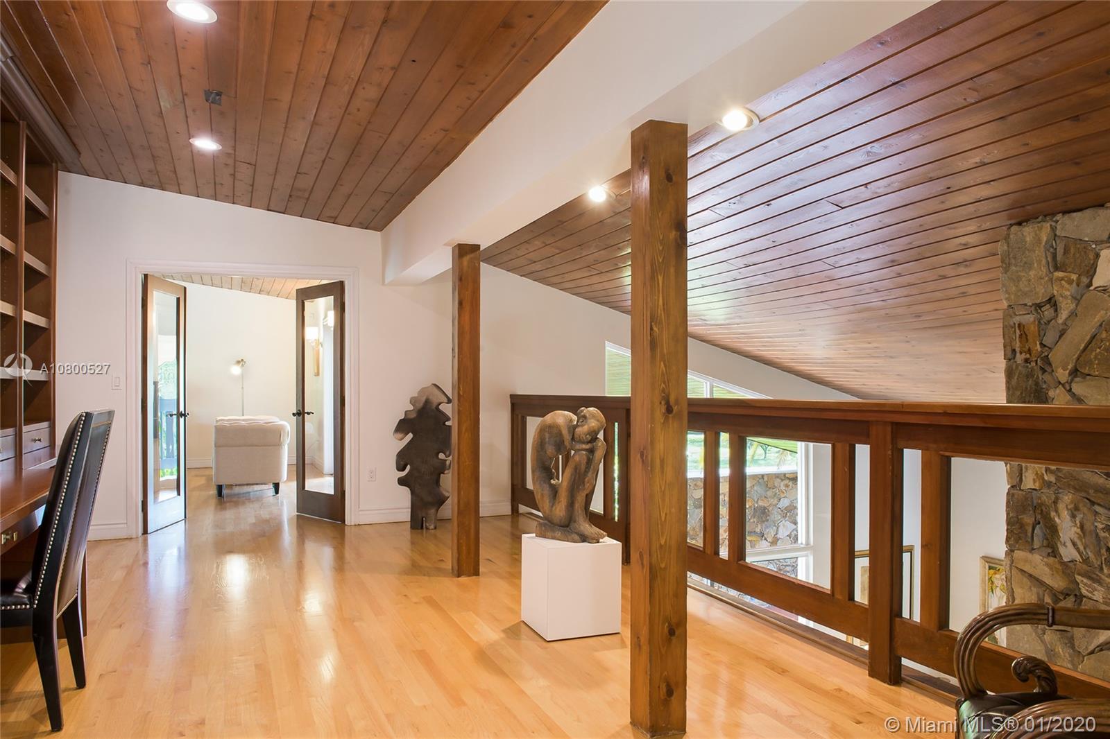 12440 Moss Ranch Road Pinecrest, FL 33156 - Photo 17 of 33 a hallway with wooden floor