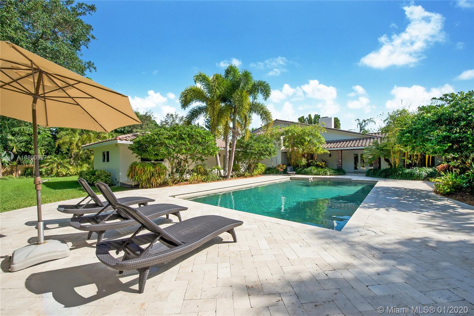 12440 Moss Ranch Road Pinecrest, FL 33156 - Photo 25 of 33 a view of a backyard with sitting area