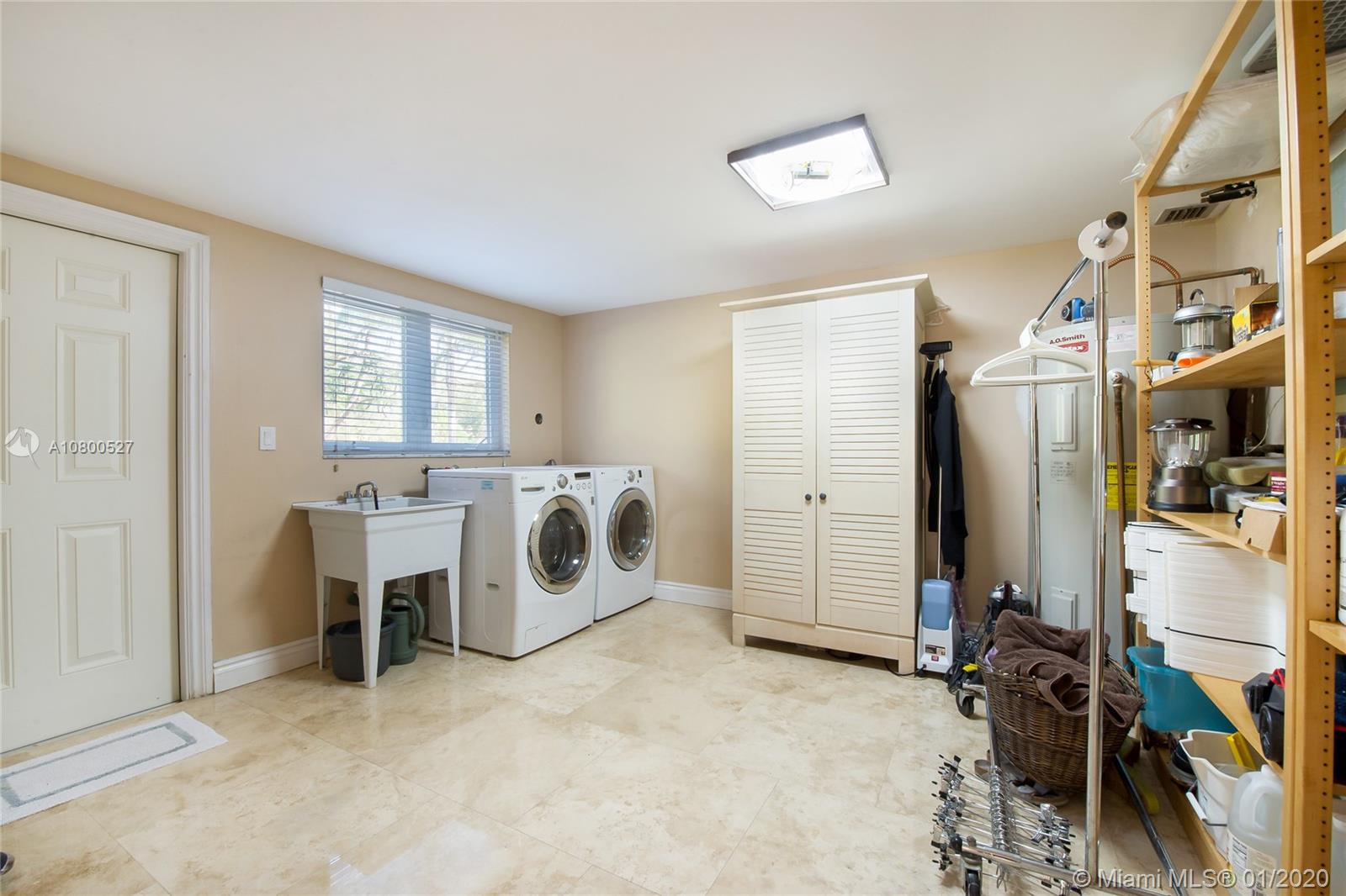 12440 Moss Ranch Road Pinecrest, FL 33156 - Photo 26 of 33 a view of a storage & utility room