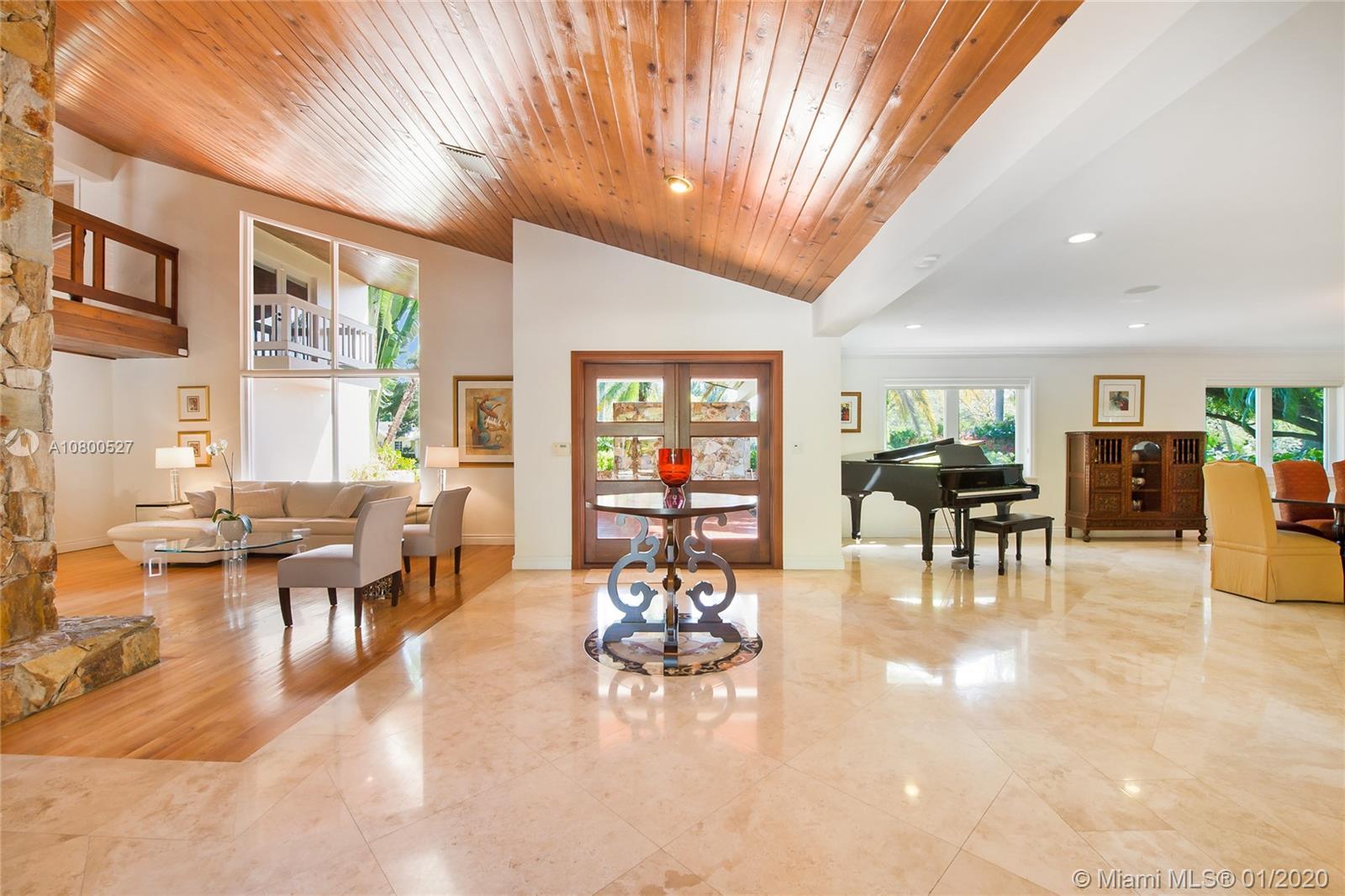 12440 Moss Ranch Road Pinecrest, FL 33156 - Photo 3 of 33 a living room with furniture and a large window