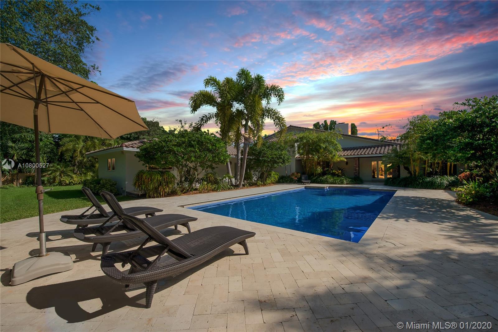 12440 Moss Ranch Road Pinecrest, FL 33156 - Photo 31 of 33 a view of a swimming pool and lounge chairs
