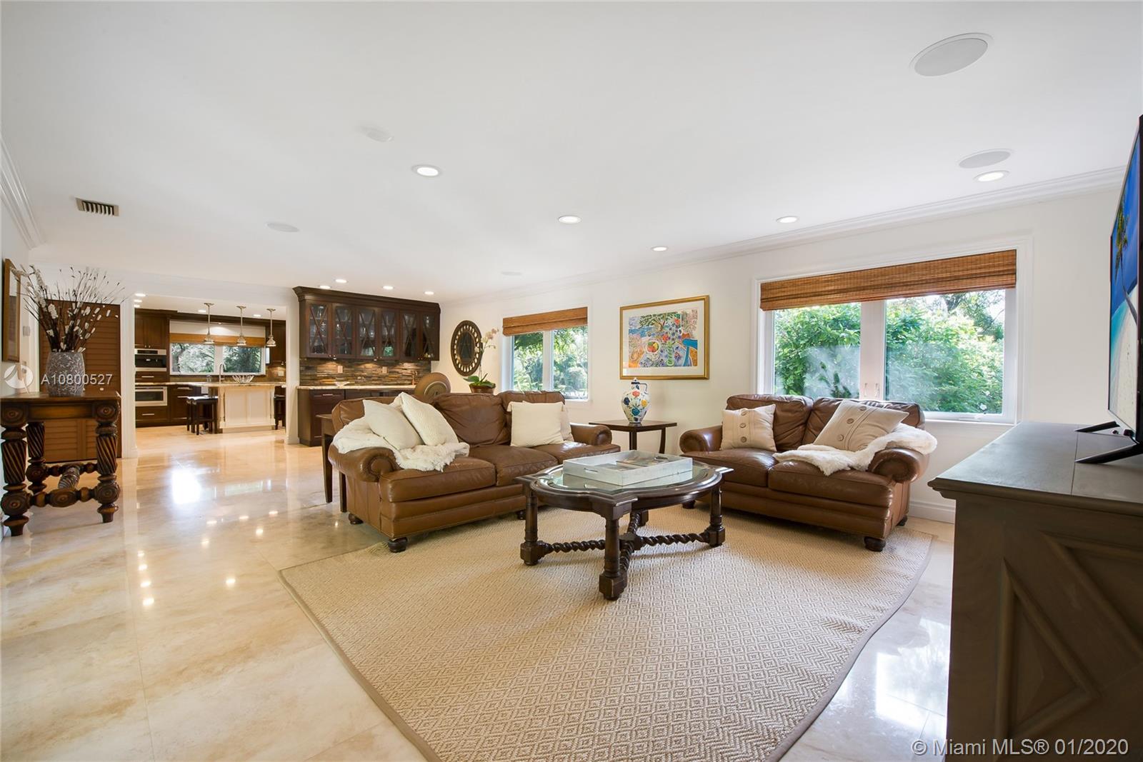 12440 Moss Ranch Road Pinecrest, FL 33156 - Photo 9 of 33 a living room with furniture and a flat screen tv