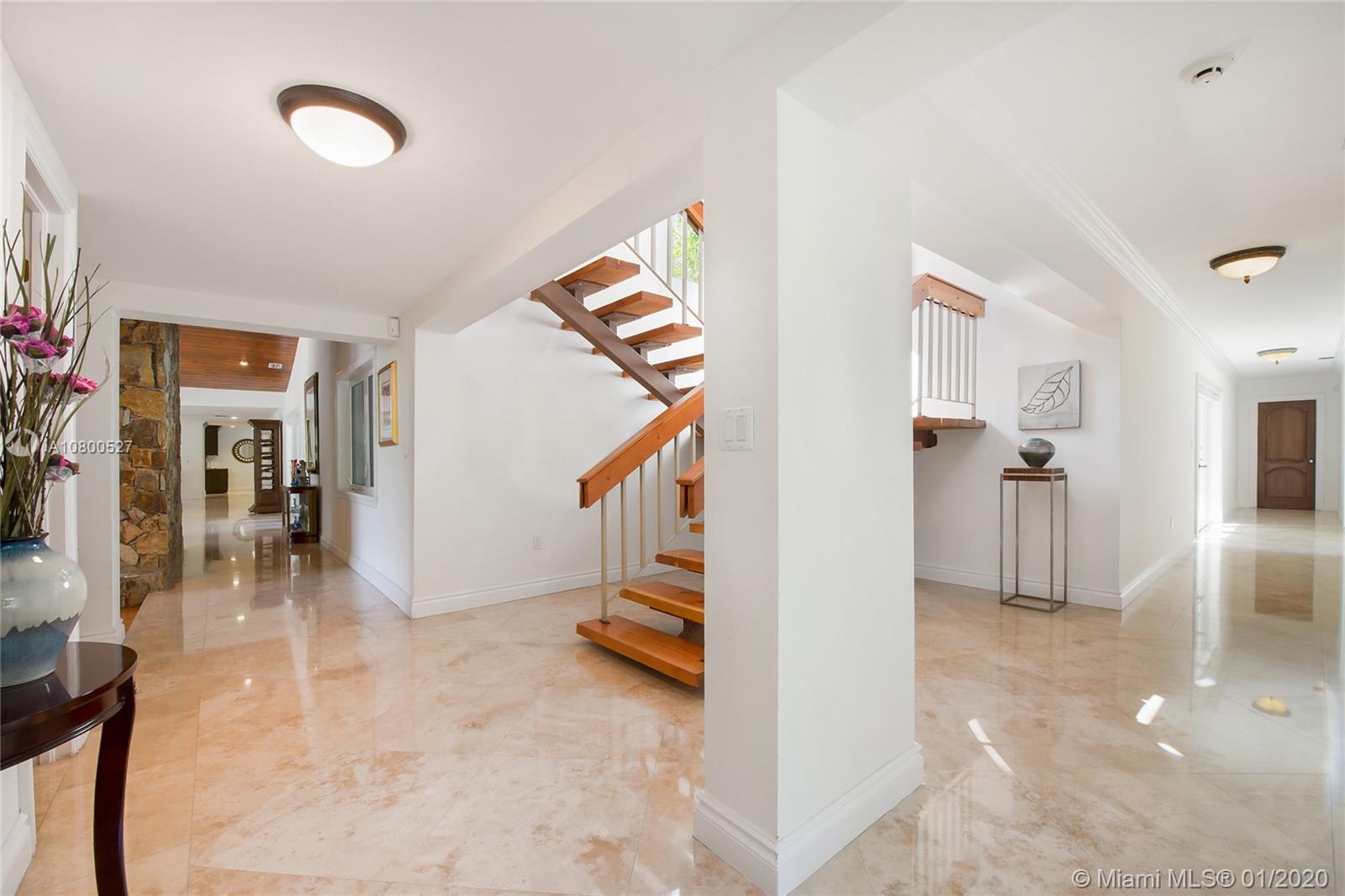 12440 Moss Ranch Road Pinecrest, FL 33156 - Photo 10 of 33 a view of a hallway view with staircase