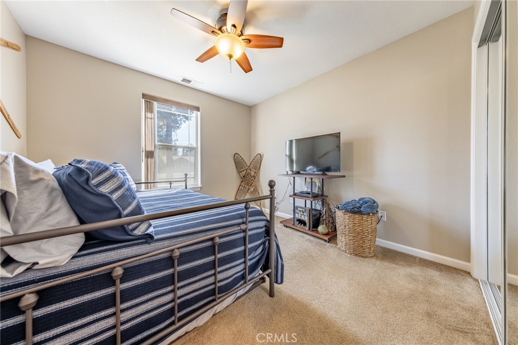 643 Purdy Road Chester, CA 96020 - Photo 15 of 29 a living room with furniture a flat screen tv and ceiling fan