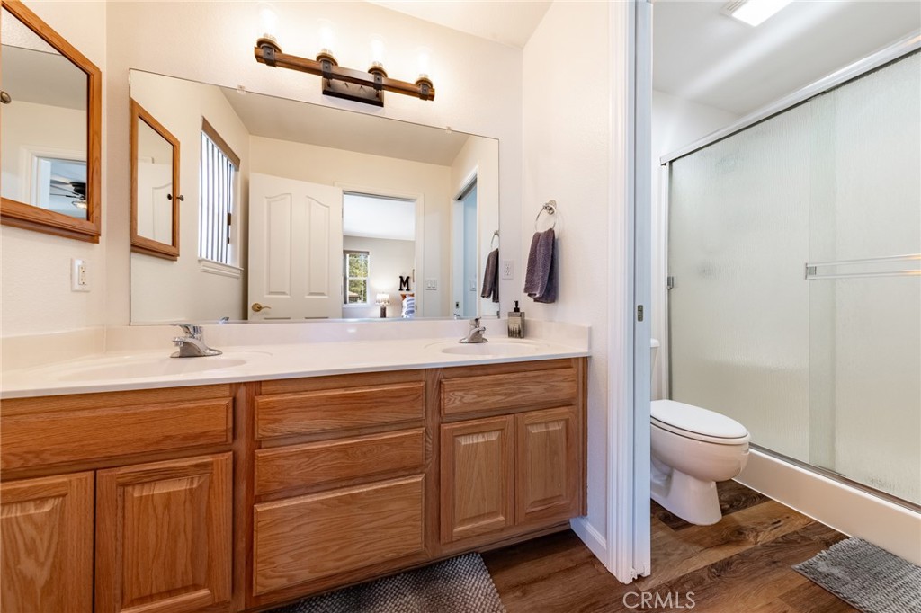 643 Purdy Road Chester, CA 96020 - Photo 21 of 29 a bathroom with a toilet sink and mirror