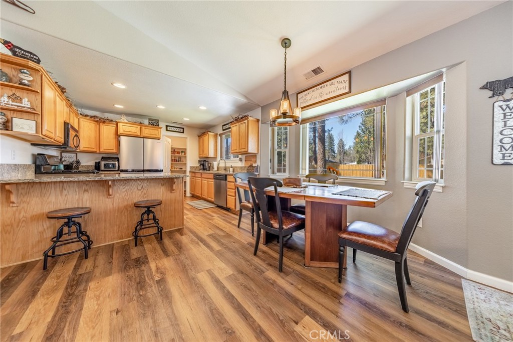 643 Purdy Road Chester, CA 96020 - Photo 7 of 29 a view of a dining room with furniture window and wooden floor