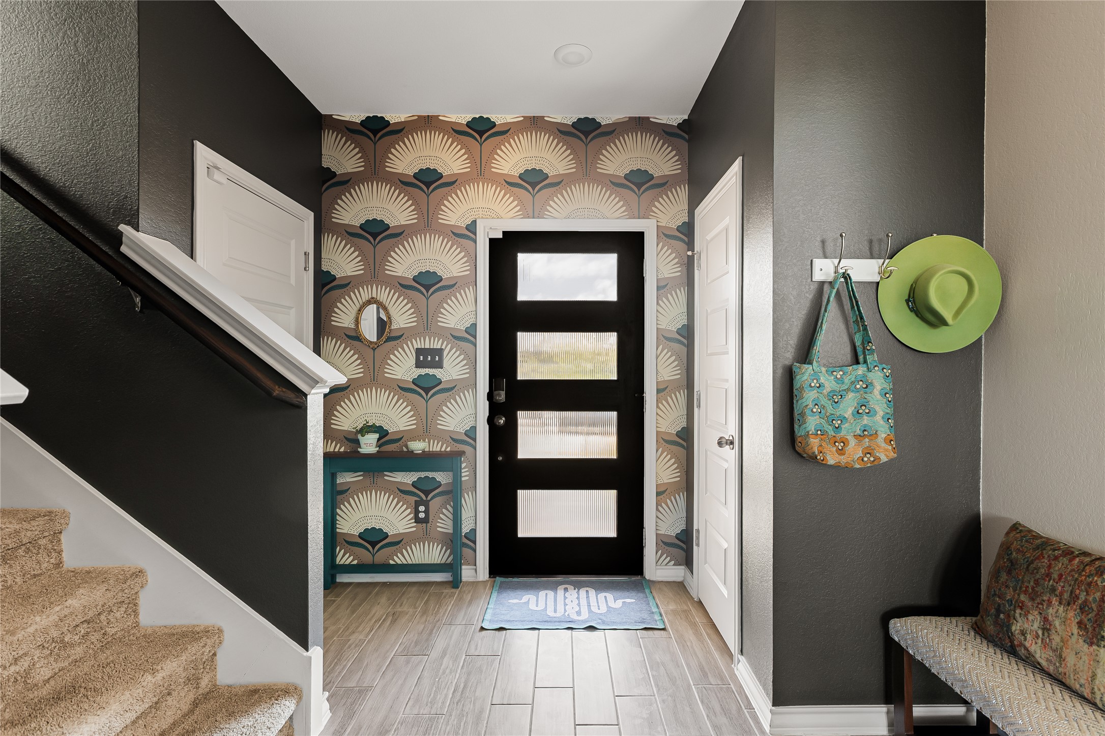 862 Pepperbark Loop Buda, TX 78610 - Photo 3 of 40 a view of a hallway with entryway and wooden floor