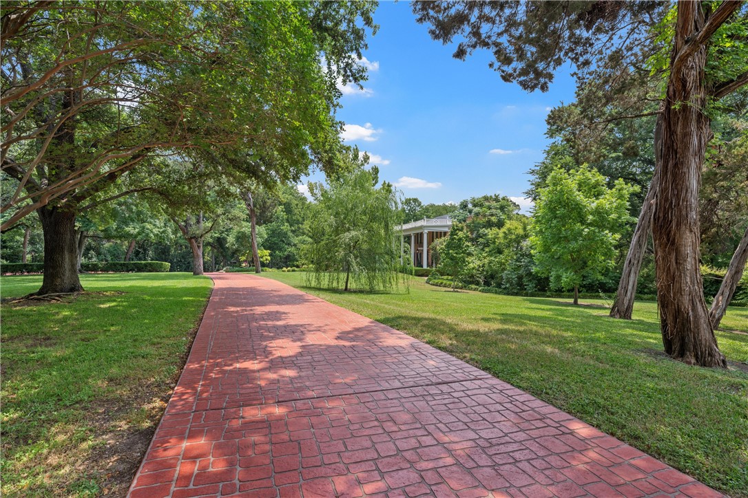 3217 Robin Road Waco, TX 76708 - Photo 6 of 61 a view of a yard with plants and trees
