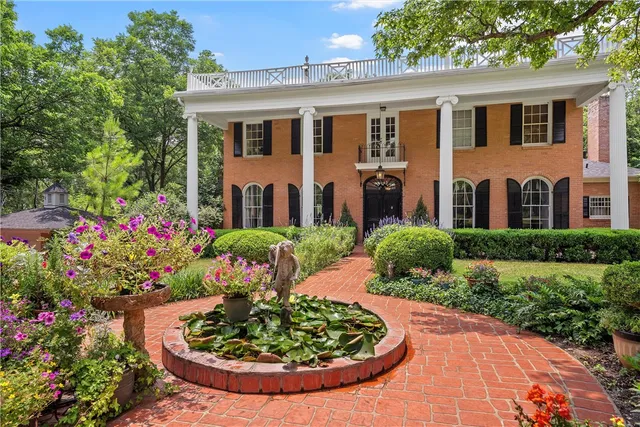 a view of a patio with table and chairs potted plants with wooden fence