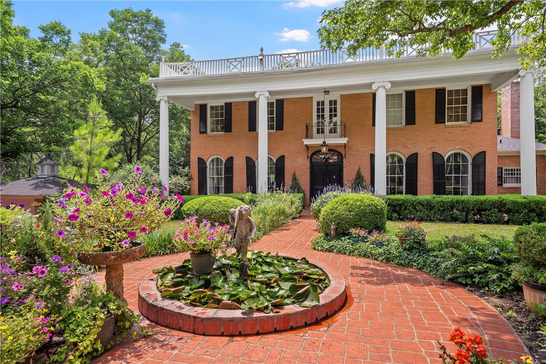 3217 Robin Road Waco, TX 76708 - Photo 9 of 61 a front view of a house with a yard and fountain