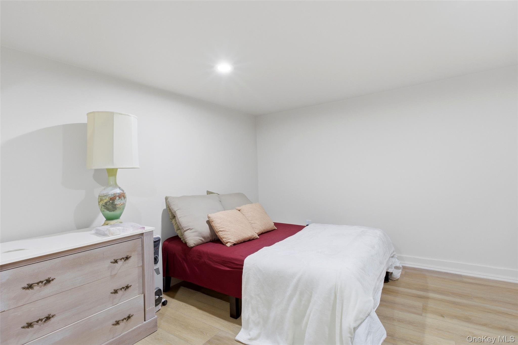 7 Gun Path Setauket, NY 11733 - Photo 28 of 34 a bedroom with a bed and a window