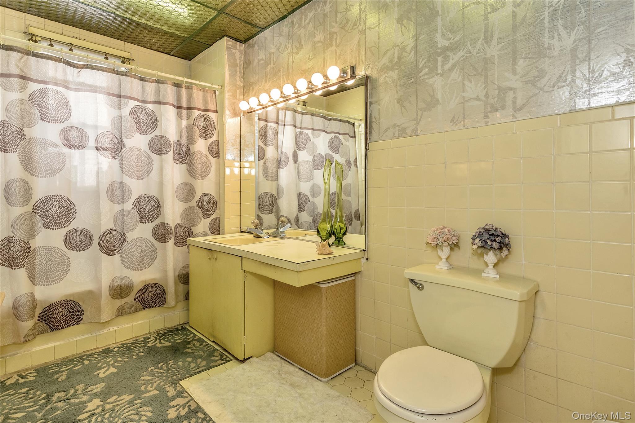 25-41 83rd Street Queens, NY 11370 - Photo 12 of 15 a bathroom with a sink toilet and shower