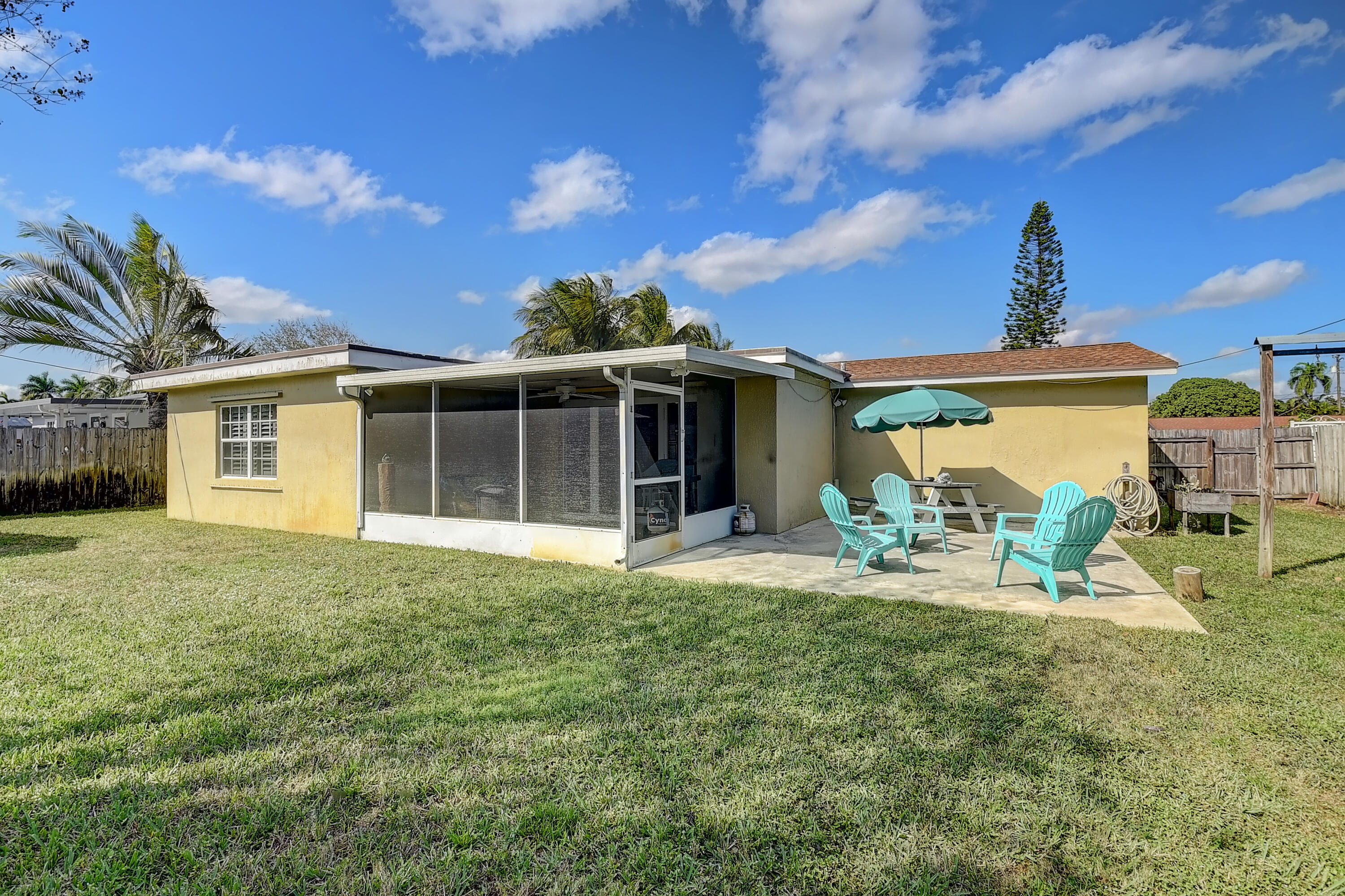 125 Riley Avenue Palm Springs, FL 33461 - Photo 19 of 24 a front view of a house with garden and porch