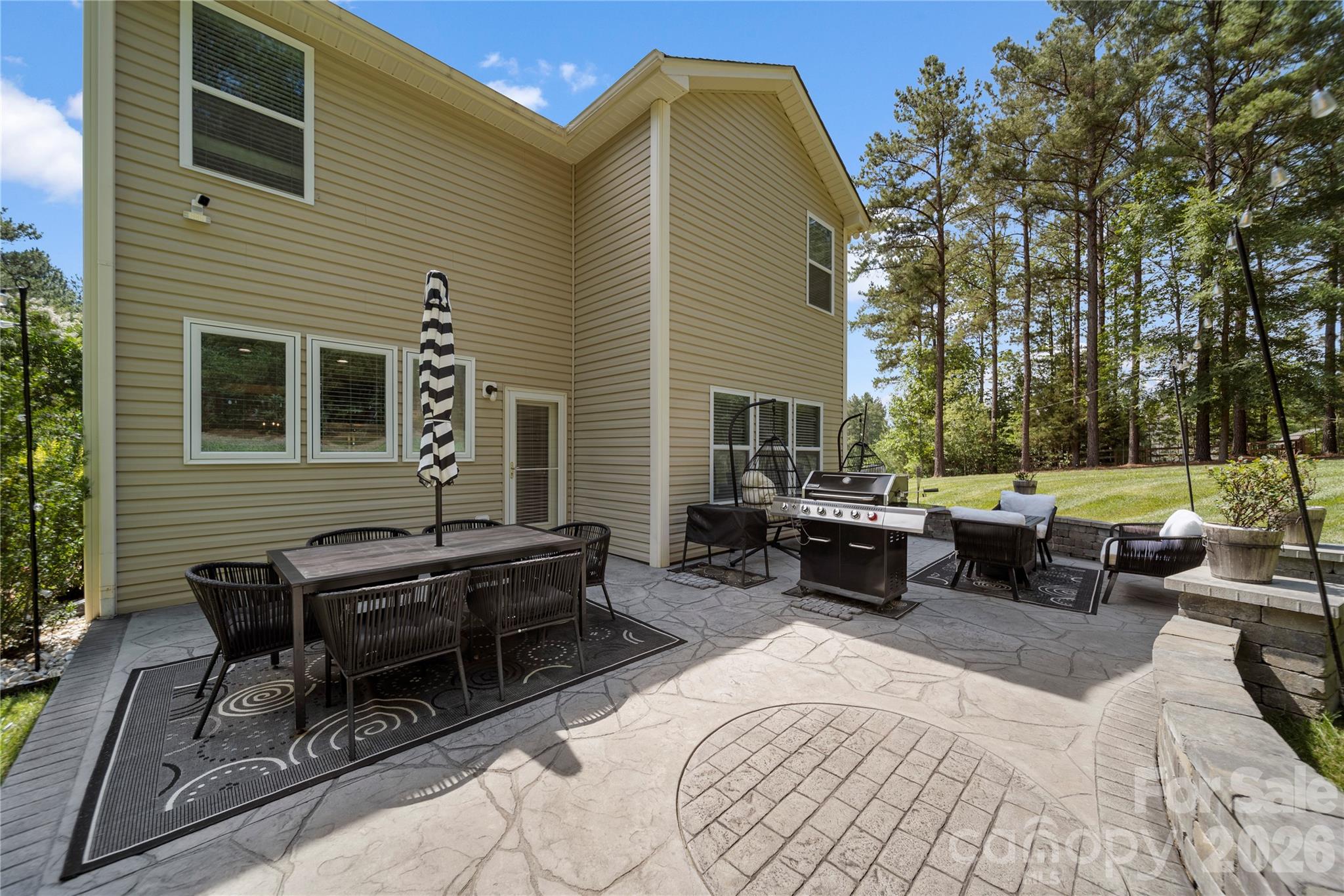 8122 Mossy Rock Road Waxhaw, NC 28173 - Photo 27 of 28 a building outdoor space with patio furniture