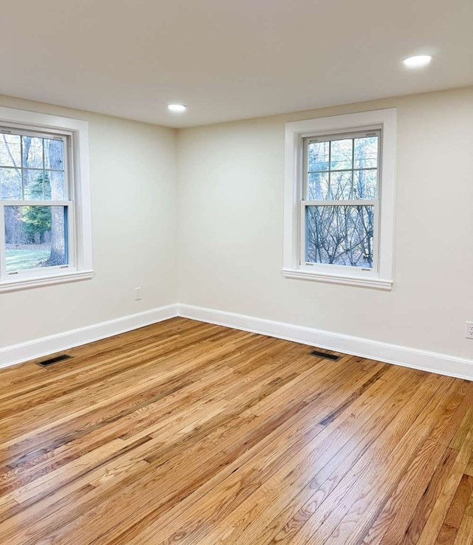 93 Moosehill Road East Walpole, MA 02032 - Photo 11 of 18 a view of empty room with wooden floor and fan