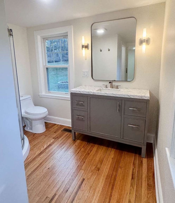 93 Moosehill Road East Walpole, MA 02032 - Photo 14 of 18 a bathroom with a sink mirror vanity and toilet