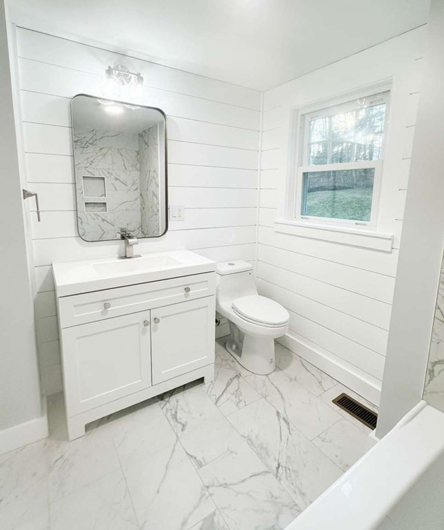 93 Moosehill Road East Walpole, MA 02032 - Photo 16 of 18 a bathroom with a toilet sink and mirror