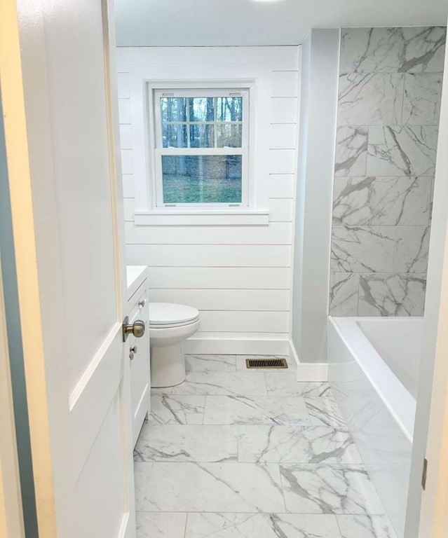 93 Moosehill Road East Walpole, MA 02032 - Photo 17 of 18 a bathroom with a toilet and a bathtub