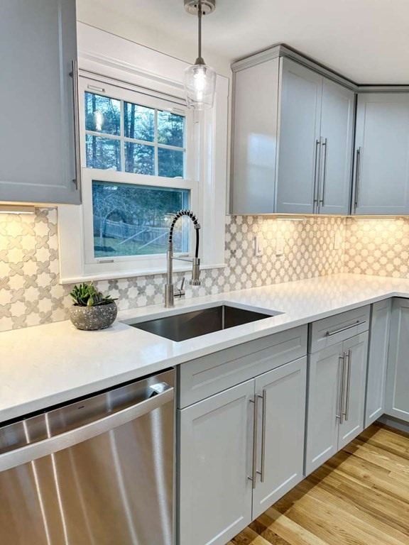 93 Moosehill Road East Walpole, MA 02032 - Photo 6 of 18 a kitchen with a sink and cabinets