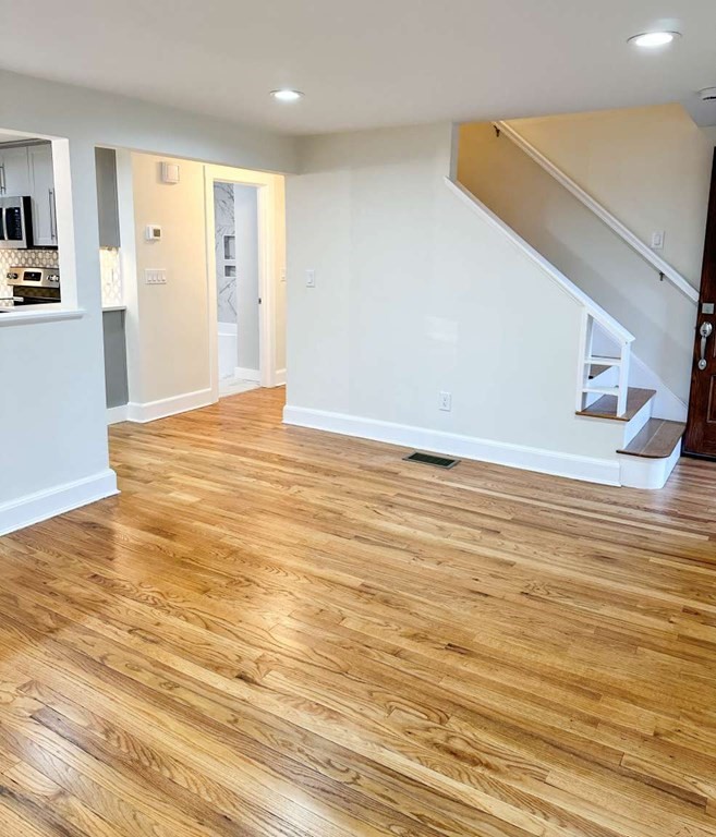 93 Moosehill Road East Walpole, MA 02032 - Photo 7 of 18 a view of an empty room with wooden floor