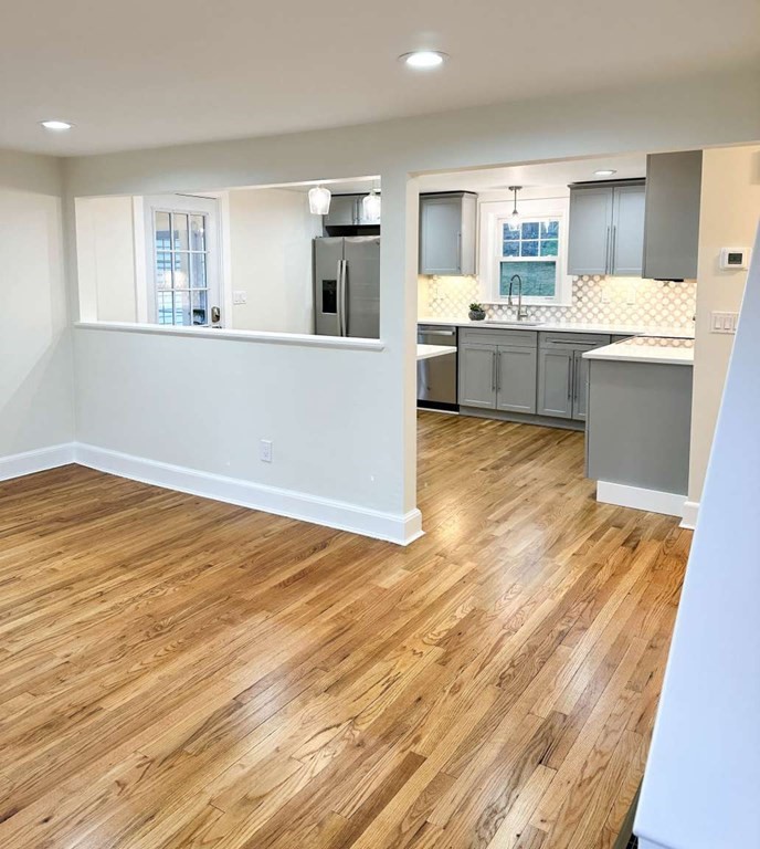 93 Moosehill Road East Walpole, MA 02032 - Photo 8 of 18 a view of kitchen with wooden floor and electronic appliances