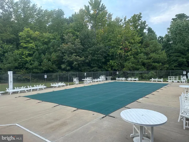 a view of swimming pool with a yard