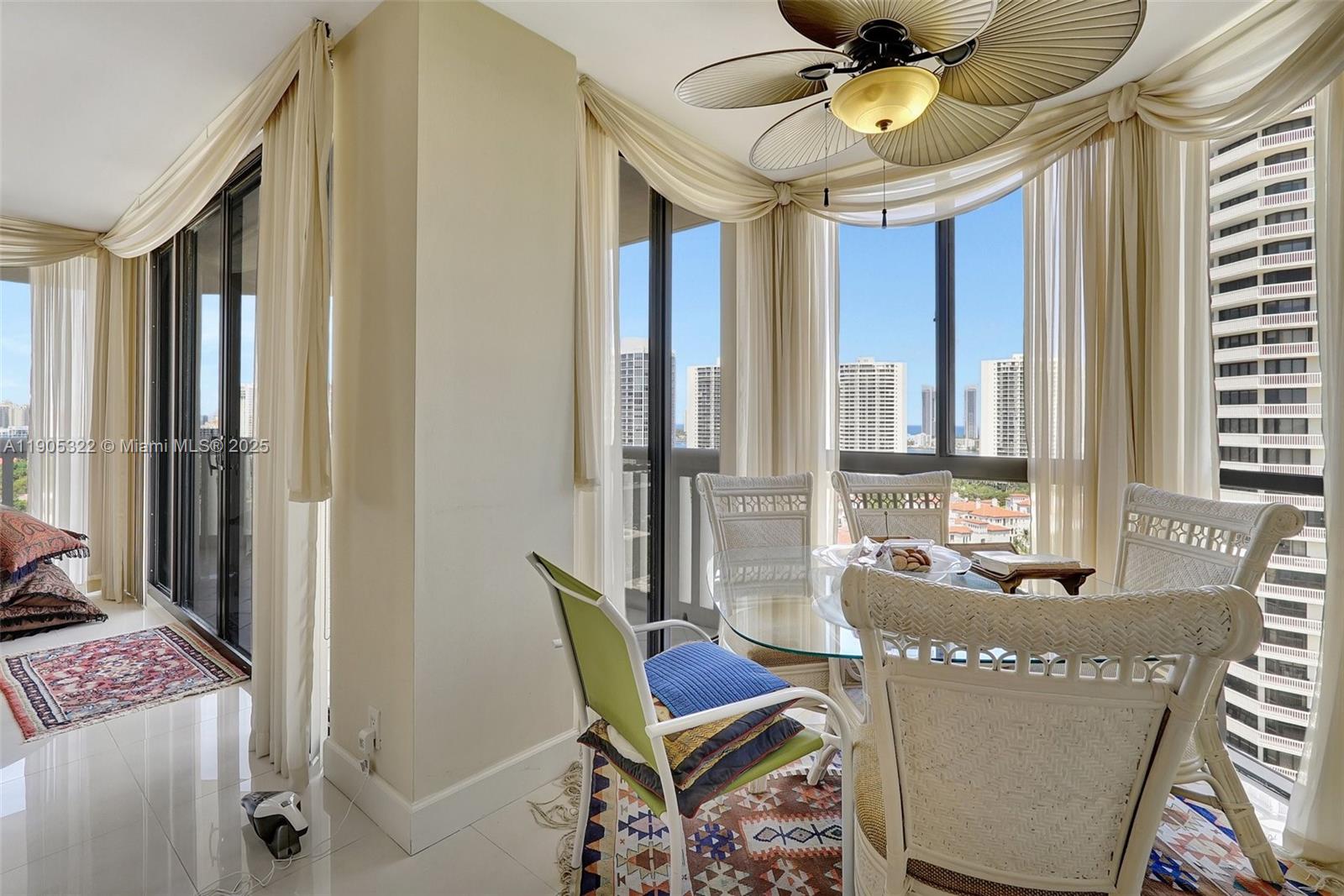 1000 East Island Boulevard, Unit 2004 Aventura, FL 33160 - Photo 14 of 45 a living room with furniture and a window