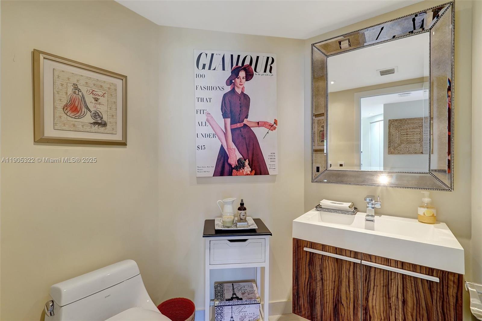 1000 East Island Boulevard, Unit 2004 Aventura, FL 33160 - Photo 21 of 45 a bathroom with a sink and a mirror