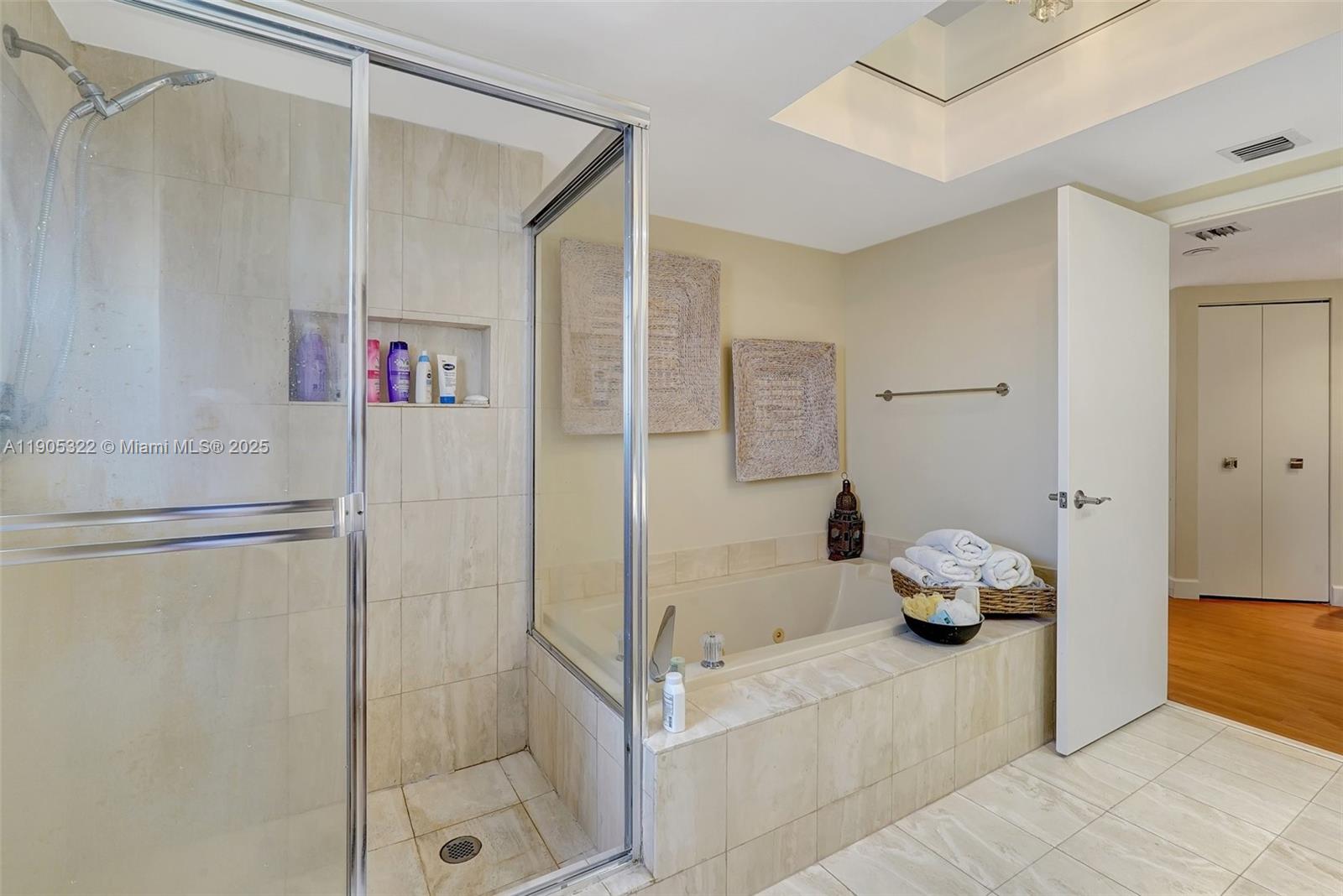 1000 East Island Boulevard, Unit 2004 Aventura, FL 33160 - Photo 26 of 45 a bathroom with a tub and shower