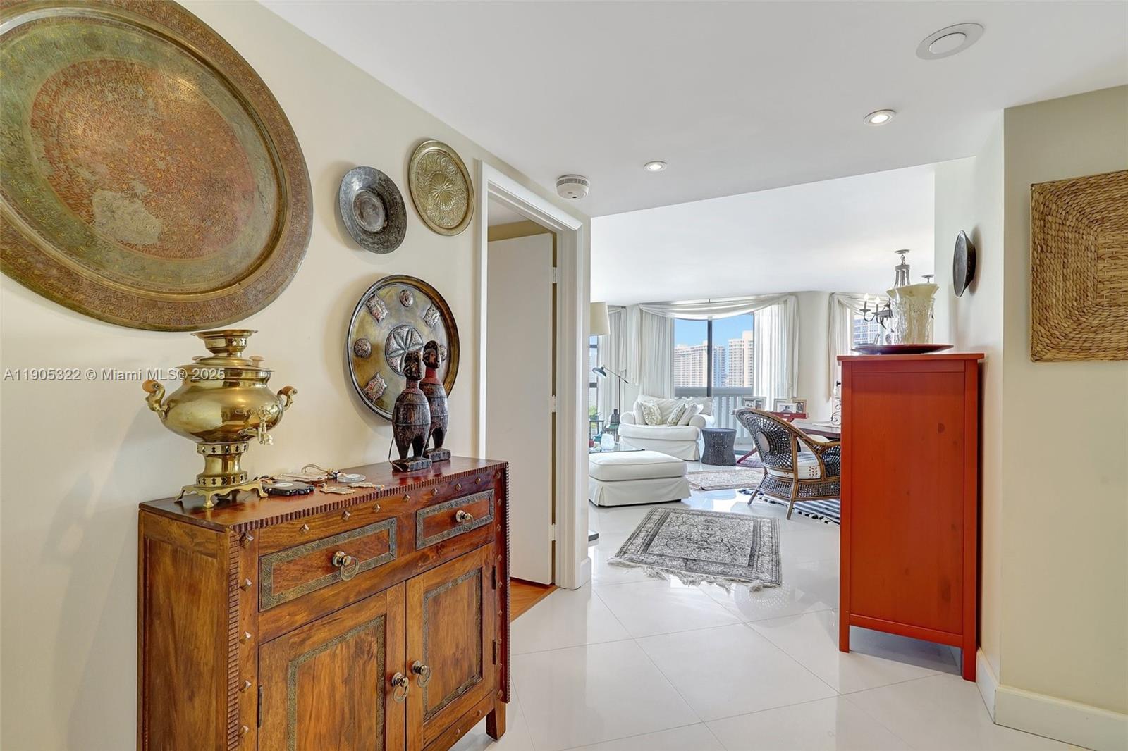 1000 East Island Boulevard, Unit 2004 Aventura, FL 33160 - Photo 3 of 45 a view of living room with furniture and a clock