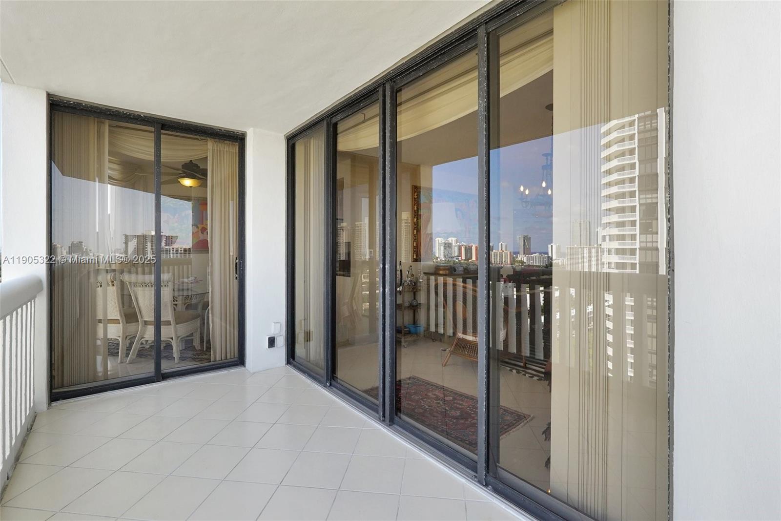1000 East Island Boulevard, Unit 2004 Aventura, FL 33160 - Photo 44 of 45 a view of a bathroom with a glass door