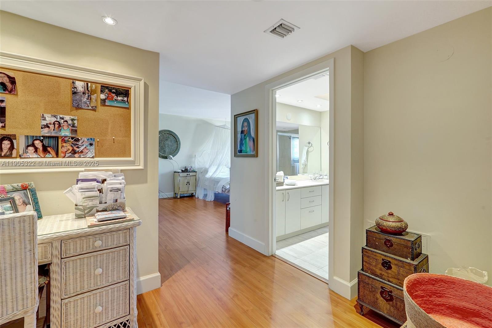 1000 East Island Boulevard, Unit 2004 Aventura, FL 33160 - Photo 9 of 45 a bedroom with furniture and a wooden floor