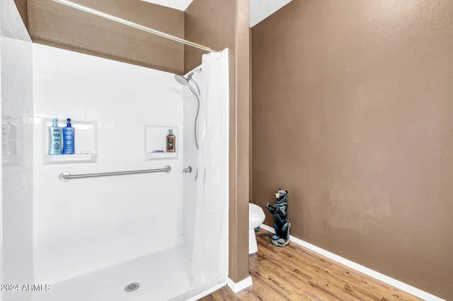 a bedroom with furniture and a window