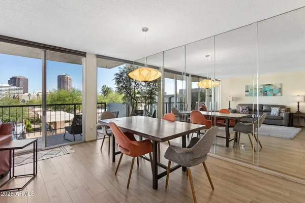 a view of a dining room with furniture and wooden floor