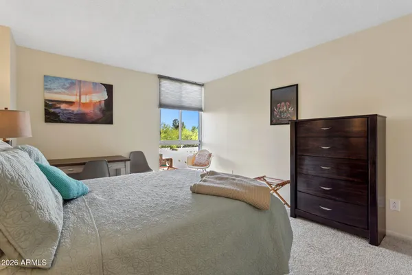 a bedroom with a bed and furniture