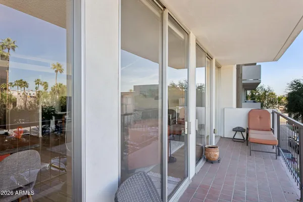 a view of a chairs and table in patio
